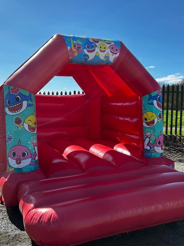 Baby Shark themed bouncy castle hire - Popular children's character castle for toddler parties Essex